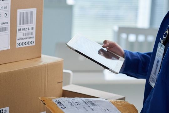 man reviewing parcel package 