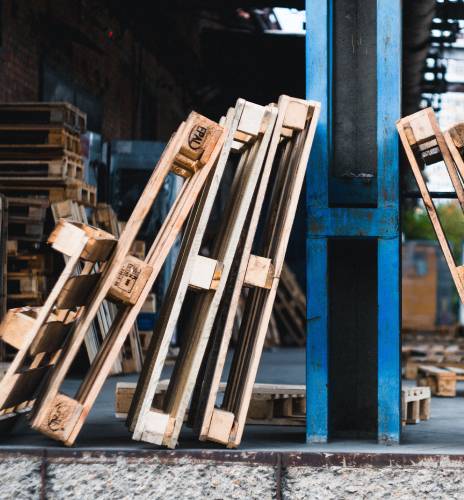 standard shipping pallets leaning on a wall